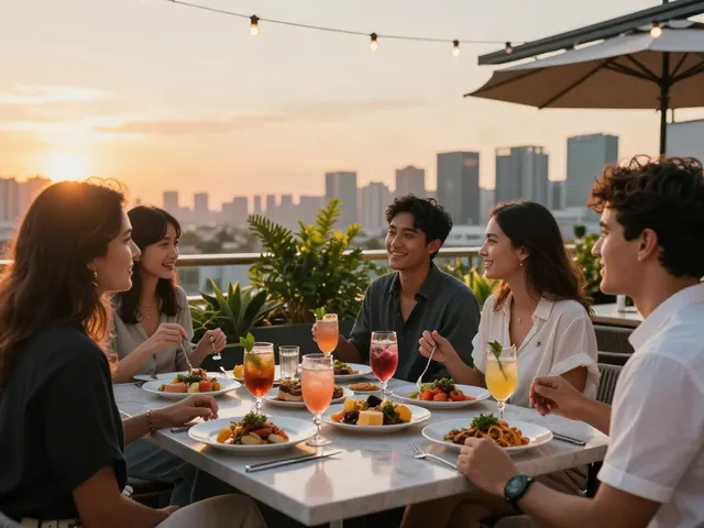 Friends enjoying vibrant dishes and cocktails at Nohu rooftop bar during sunset.